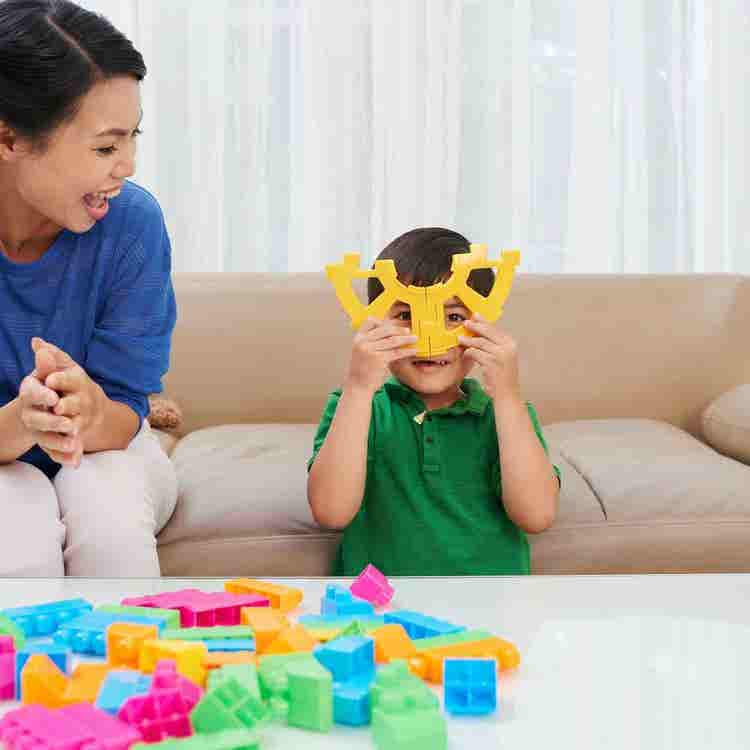 A focused clinician guides a young child through repetitive articulation practice to improve speech sound consistency and overall intelligibility.