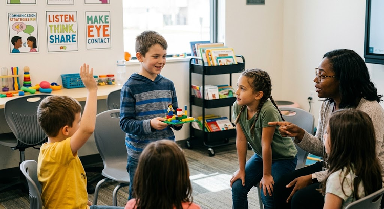 A group of children with an engaging therapist, practicing active listening and sharing during story-building with blocks.